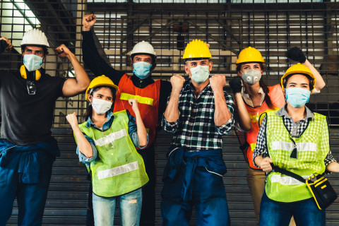 Happy-EHS-people-mask-fist-pump_AdobeStock_333965721
