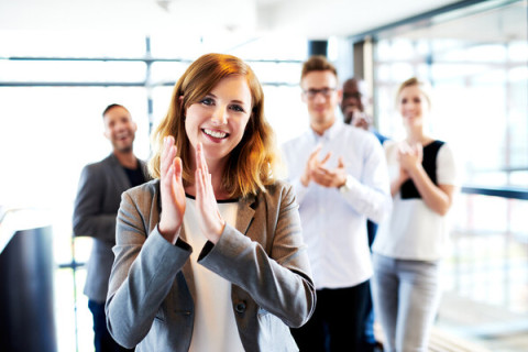 Female-clapping-with-collegues_Fotolia_85653689_M-med
